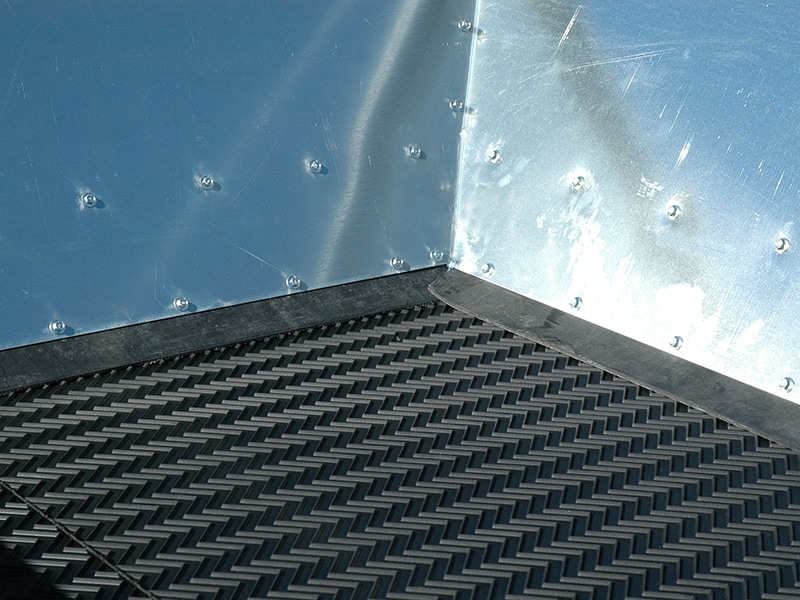 Galvanized hopper (no rusting—or potential rust flakes in topdress material).
